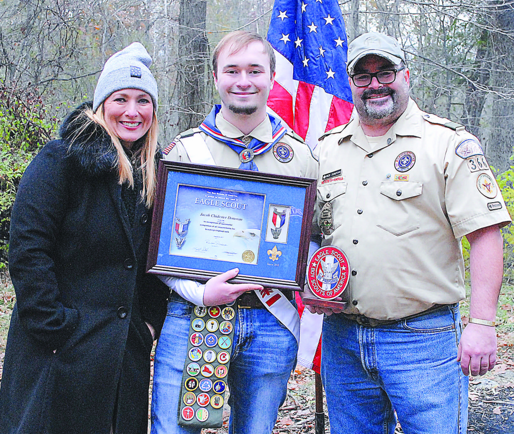 Eagle Scout Jacob Donovan (center) with his parents Stacey Volante and Rick Donovan. Photo by David Zanin.