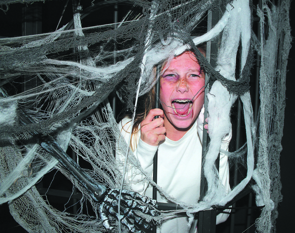 Cecelia Nicholson, an OMS seventh-grader, gives us her best scream in the haunted house. Photo by C.J. Carnacchio.
