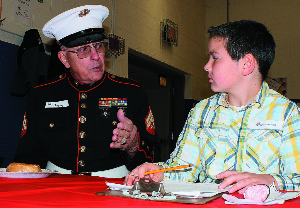 Oxford resident Hugh Syron wore his Marine Corps dress blues for his big interview with Leonard fifth-grader Patrick Wozniak. Syron served in the Corps from 1965-69 and spent 14 months in Vietnam. Photo by C.J. Carnacchio.
