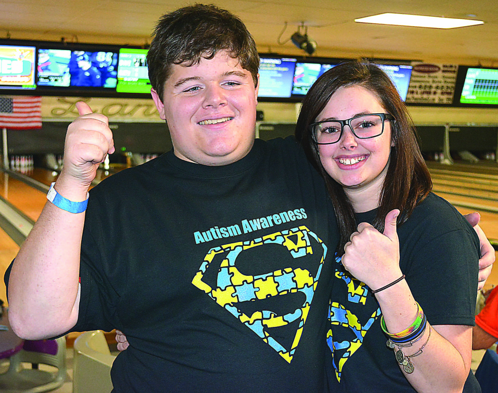Andrew Pezolt (left) and Jordyn Zyngier gave a big thumbs up to the approximately 100 folks who attended the Autism Awareness fund-raiser held Sunday at Collier Lanes. Photo by CJC.