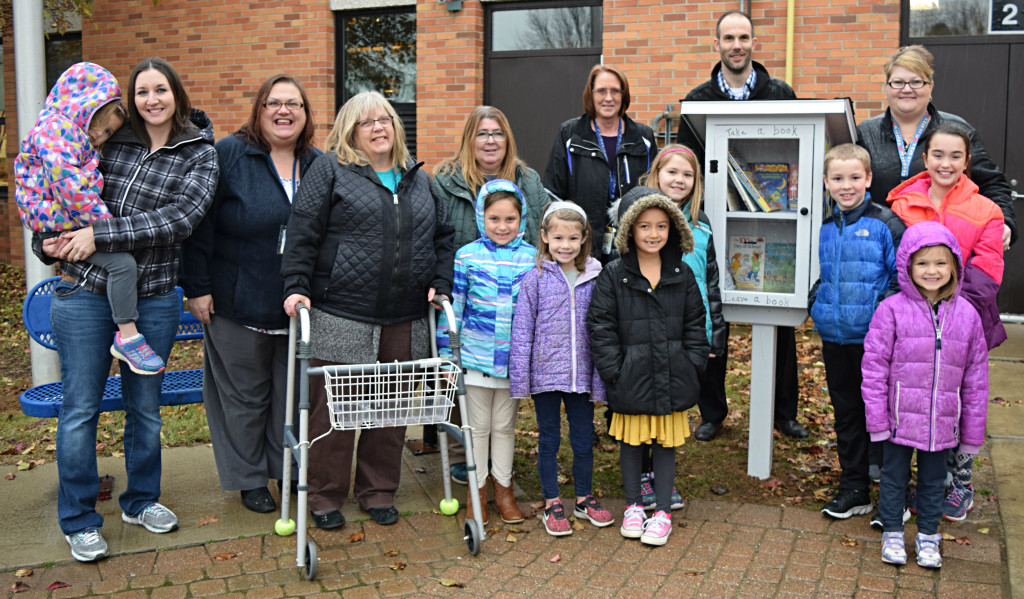 Students and staff from the OELC Extended Day and Great Start Readiness Programs (GSRP) filled Clear Lake’s new Little Free Library with books last Wednesday. Those who helped were Pat Mueller, Maggie Hosner, Macy O’Neill, Avery Adams, Dianna Wright, Aiden Minke, Alivia Eagle, Audrey Corbett, Ariana Naegle, Geena Naegle, Karen Morris, Kim Keenan, Dee Thiele, Principal Brad Bigelow and Laura Armbruster. Photo by Elise Shire.