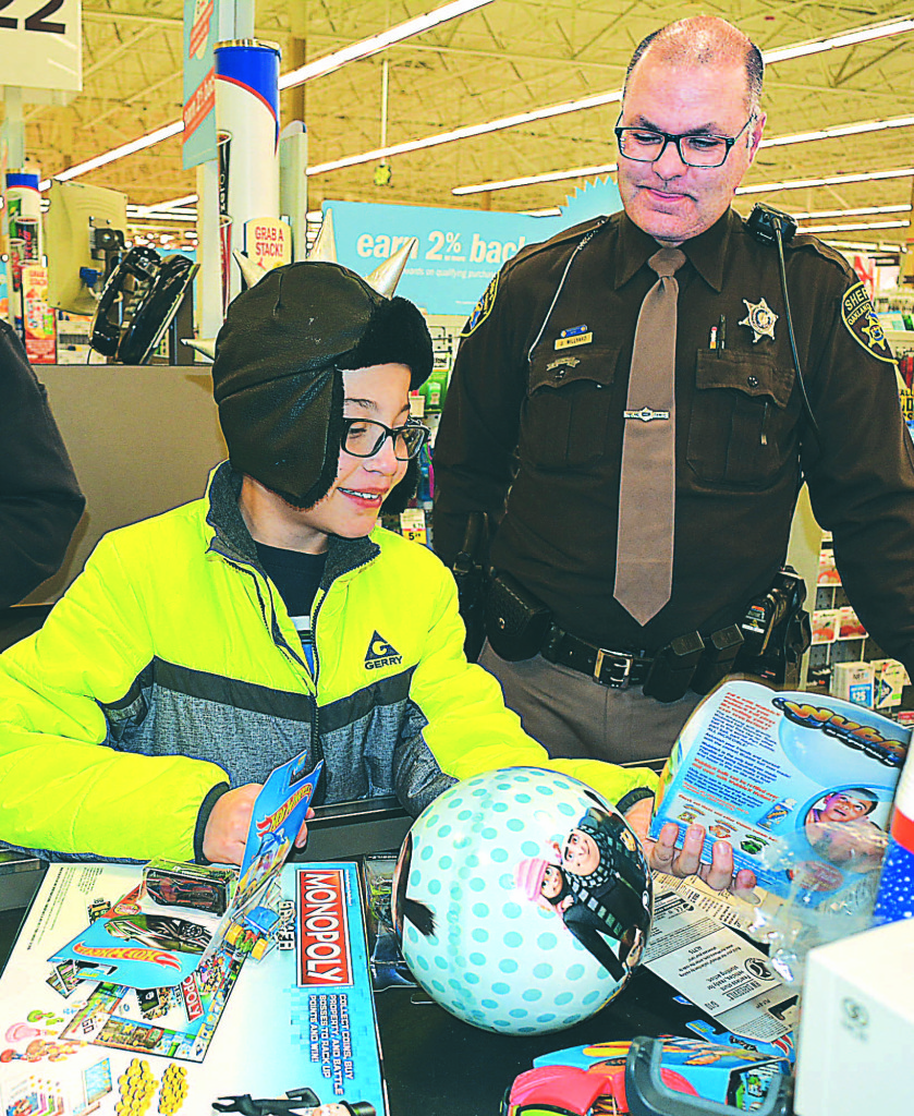 Shopping with the Oxford Village Police were Maddie and Melena Bovee, Clementine, Quentin and Coraline Collison, Kira and Quinn Corrigan and Alex Williams. Participating department members included James Owens, John Drake, Justin Noland, Paula Grech, Robyn Zanin, David Zanin, Chief Mike Solwold and Sgt. Clint Ascroft. Photo by C.J. Carnacchio.