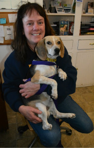 Lori Stevenson, president of the K9 Stray Rescue League, and L.B., a beagle for which the group is helping to get a prosthetic leg. Photo by C.J. Carnacchio.
