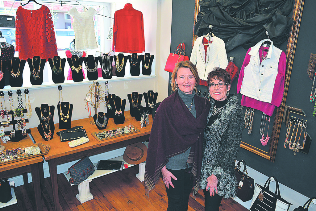 Patricia Duke (left), director of Love INC of North Oakland County, and Boulevard Boutique owner Sue Oles are hoping to sell 200 tickets to the Feb. 28 fashion show fund-raiser. Tickets are available at the 5 S. Washington St. store. Photo by C.J. Carnacchio.