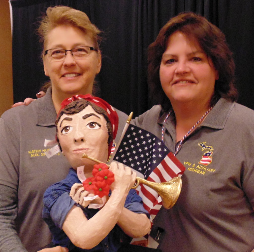 Kathy Hubbard (left), president of North Oakland Ladies Auxiliary #334 Veterans of Foreign Wars and Department Poppy Chairman Diana Ward stand with their winning Rosie the Riveter display at this year’s Mid-Winter Conference. Photo provided.