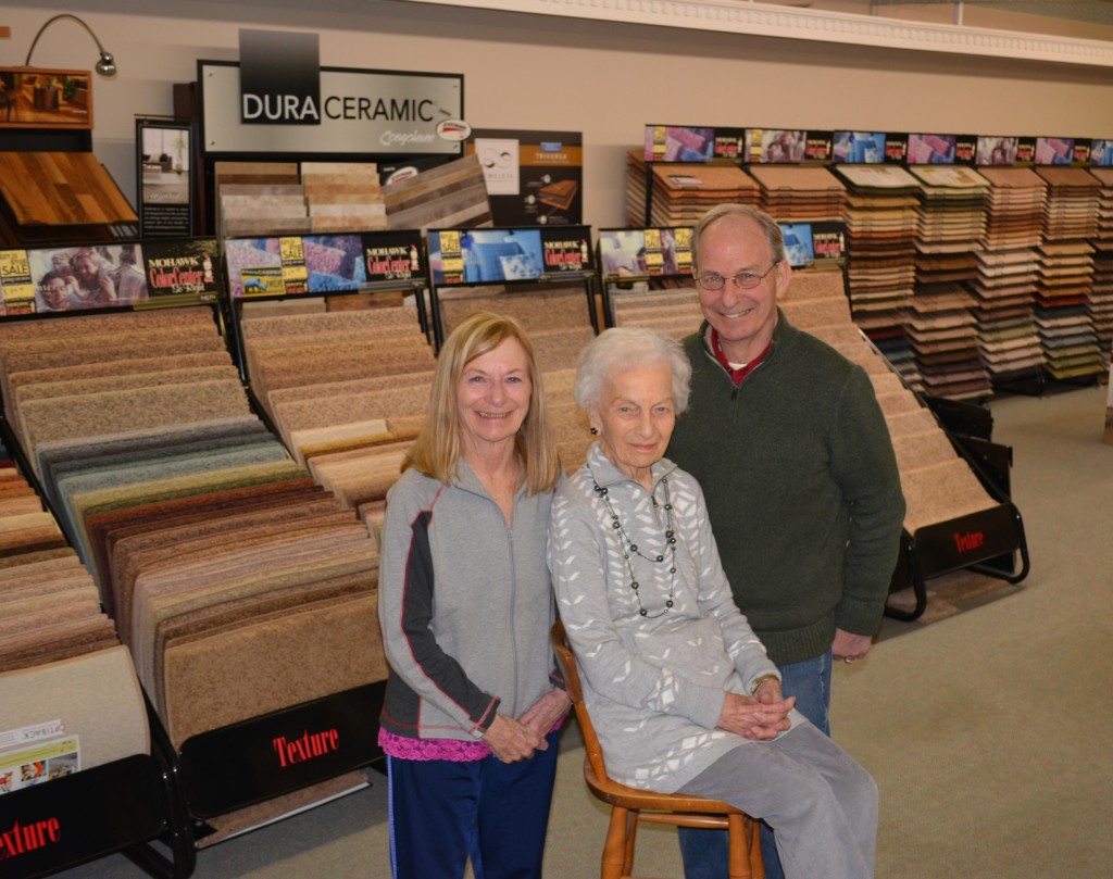 The family behind Curtis Floor Covering – Karen Etherton (from left), Gertrude Curtis and Harry Curtis – is very grateful to the legions of loyal customers who have supported them since 1954. The business will continue taking orders until March 31. Photo by CJC.