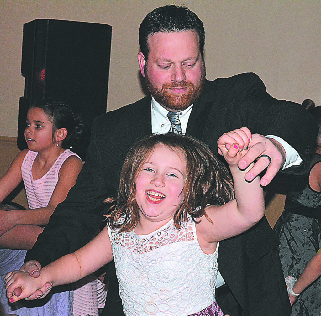 Keith Knight cuts a rug with his daughter Corinne Knight, a third-grader at Clear Lake Elementary. Photo by C.J. Carnacchio.