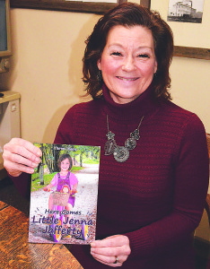 Terra Kern, a 1980 OHS graduate, and her new book "Here Comes Little Jenna Jafferty." Photo by CJC.