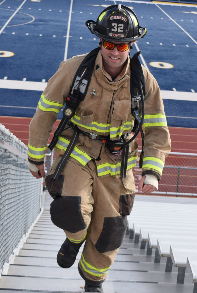 Oxford firefighter Ryan McLeod was one of eight emergency personnel who ran the steps of the OHS stadium bleachers on Sunday. He led the team that day, running 1,050 steps in a time of 22 minutes and 35 seconds. Photo by Elise Shire.