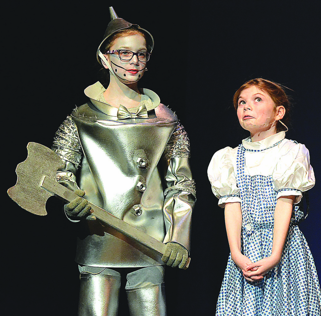Peyton McDevitt, as Dorothy, in a scene with the Tin Man, played by Eva Rayner.