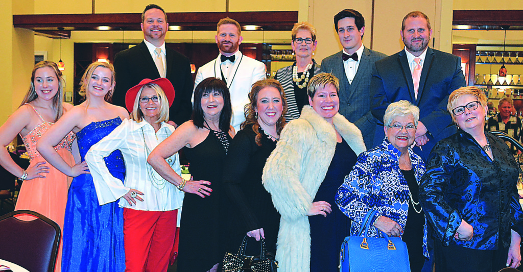 Models at the Love INC fashion show fund-raiser held Feb. 28 at the Boulder Pointe Golf Club and Banquet Center in Oxford included: Back row (from left) – Chris Barnett, Jordan Quick, Lori Greco, Anthony Grupido and Matt Pfeiffer. Front row (from left): Margaret Vieaux, Julie Gressier, Carolyn Vandenkieboom, Louise Clouse, Jessica Christensen, Jill Brzezinski, Nancy Keel and Leslie Wesclay.