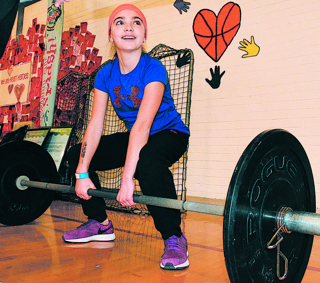 Lakeville fifth-grader Anna Terenzi is ready to pump some iron. Photo by C.J Carnacchio.