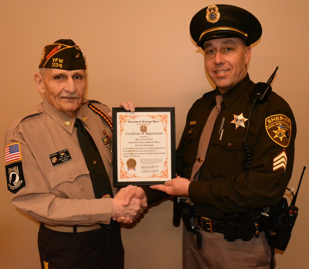 Oakland County Sheriff’s Sgt. Frank Lenz (right) receives a certificate honoring him as North Oakland VFW Post 334’s Law Enforcement Officer of the Year from Mike Ledford, the post’s community service officer. Photo by C.J. Carnacchio.