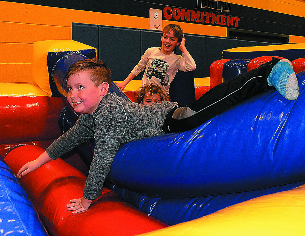 OES third-grader James Kaufman takes on the inflatable obstacle course. 