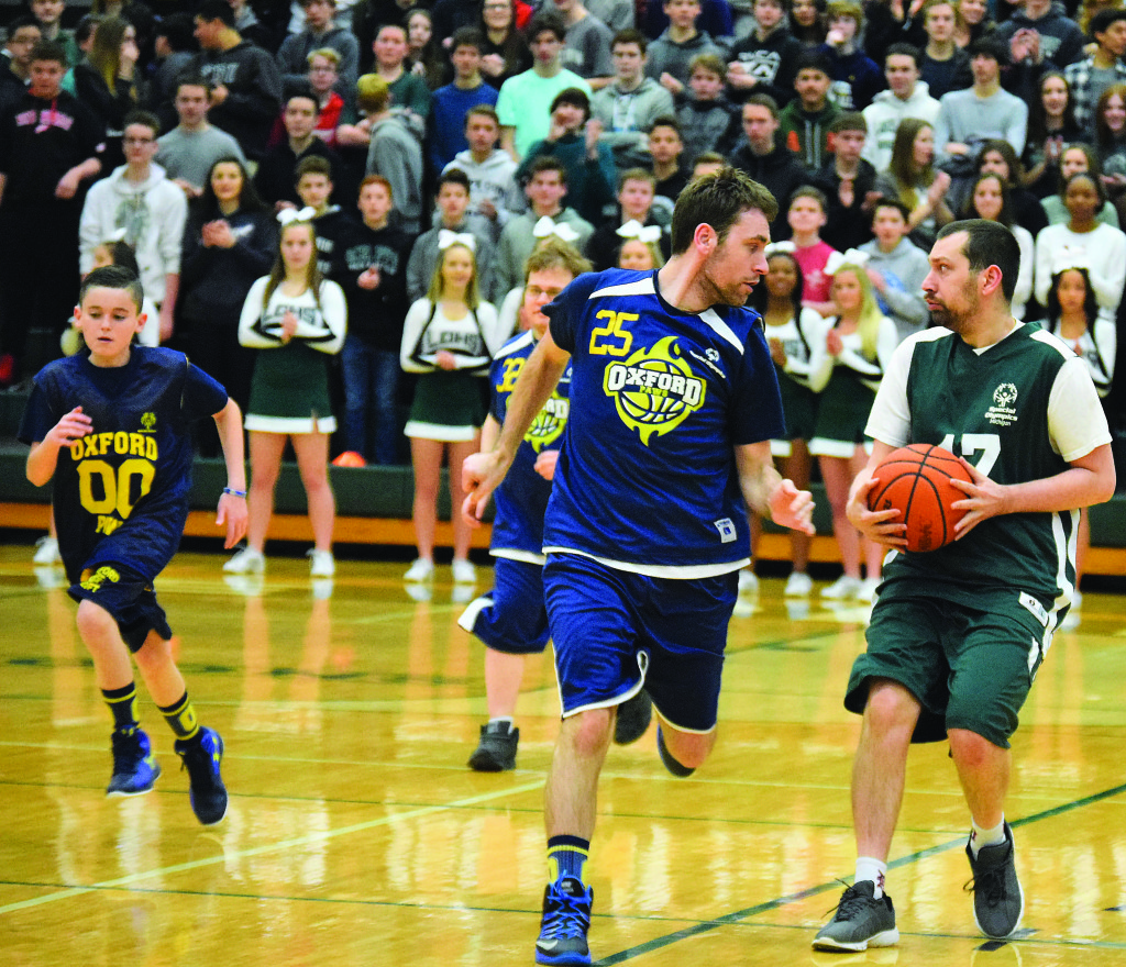 Oxford’s Gregg Bett. no. 25, chases down Bryan Betty, of Lake Orion.