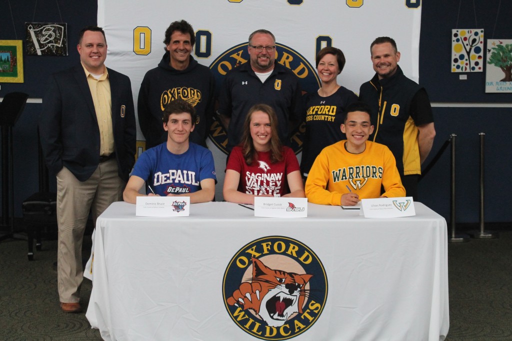 Wildcat runners Dominic Bruce (from left), Bridget Cusick and Ulises Rodriguez signed last Thursday to continue running track and cross country at their respective colleges. Photo provided.
