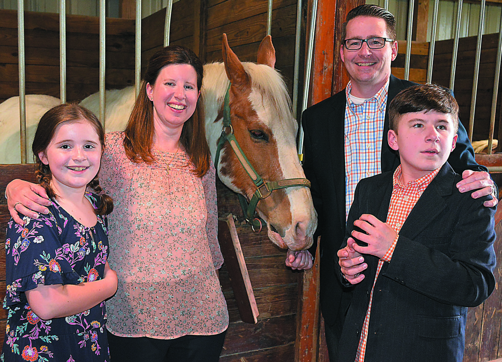 Gabe Vandelinder (far right), the 2018 Junior Star Student, and his family poses with Doodle Bug the horse. Gabe’s family includes (from  left) sister Abby, 10, mother Karen and father Greg. 