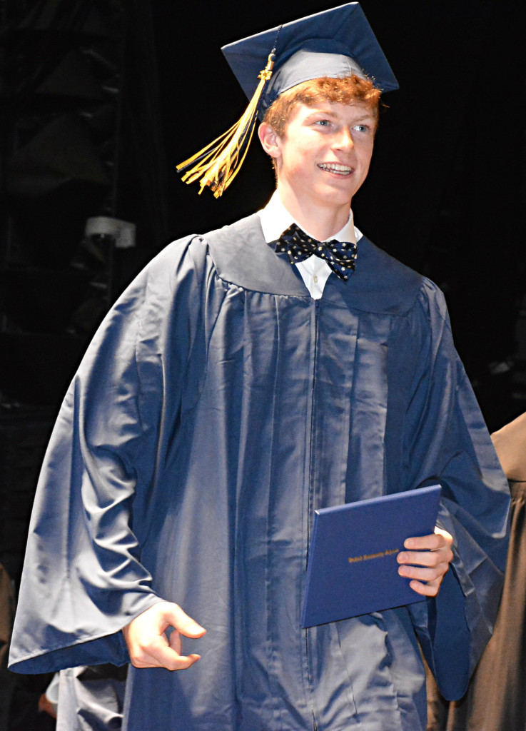 With diploma in hand and a smile on his face, Jacob Sharpe ends his high school career. Photo by C.J. Carnacchio.