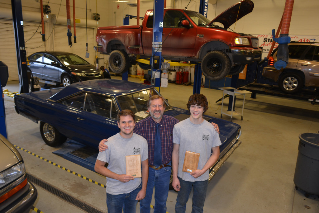 OHS seniors Austin Hunter (left) and Kyle Kalbfleisch (right) earned awards May 4 at the Automotive Advanced Service Technology competition conducted by the Michigan Industrial and Technology Education Society. Between them is OHS Automotive Technology Instructor Dan Balsley. Photo by C.J. Carnacchio.