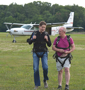 Dr. Mike Kubinski (left) and Oxford Township Supervisor Bill Dunn chat about the experience following their tandem jumps. Photo by CJC.