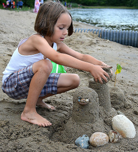 Oxford resident Maddock Henery, 8, builds a sandcastle on the beach at Stony Lake Twp. Park, one of four township parks that relies on the parks/rec. operating millage to keep it open and running. Photo by C.J. Carnacchio.