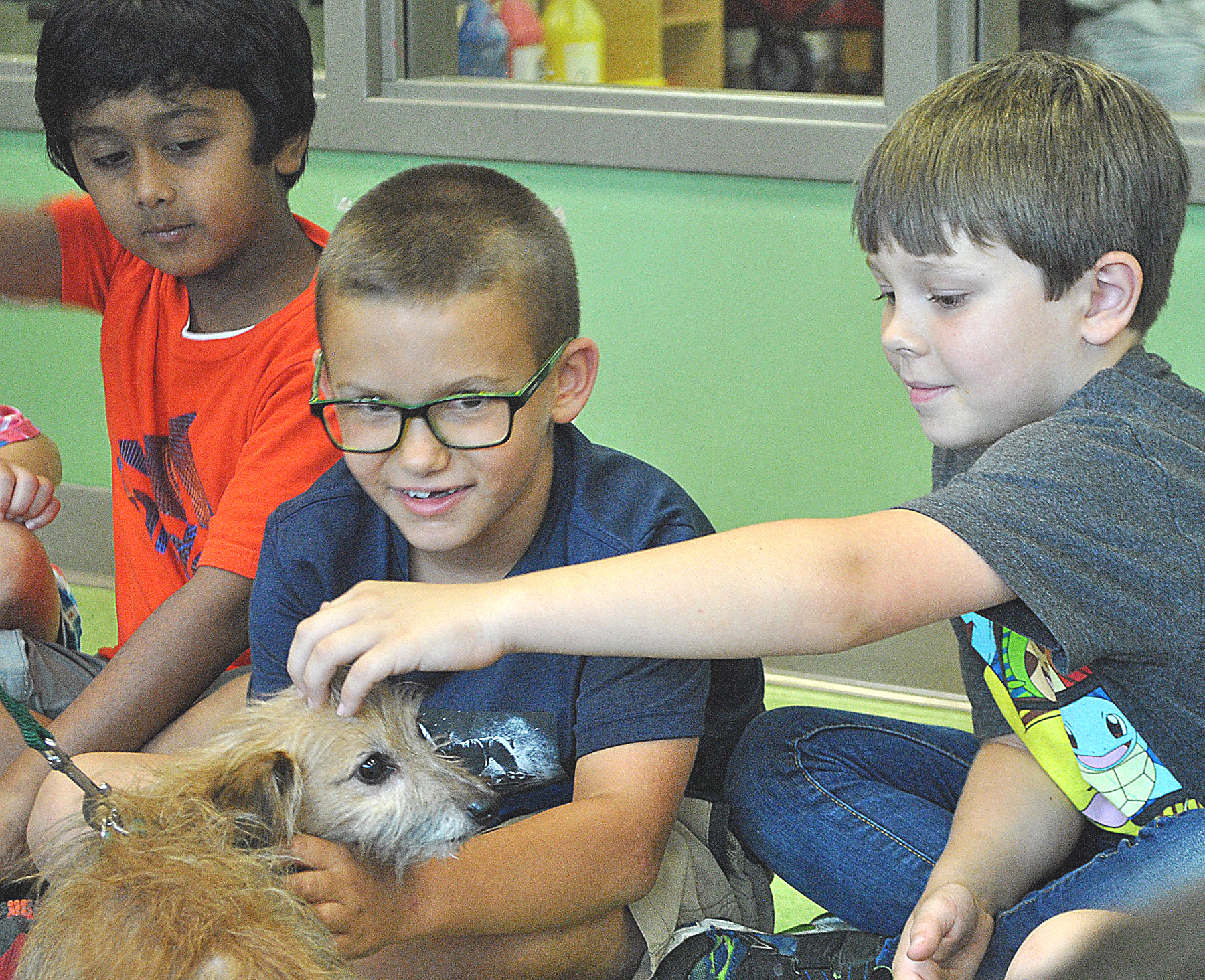 Scruffy the dog plays with kids at the Oxford Early Learning Center’s summer day camp. Photo by Shelby Tankersley.
