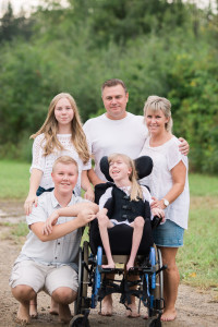 Pictured top to bottom, left to right, the Boothe family of Lily, Brian, Kirsten, Gabe and Chloe were gifted a vacation by Make A Wish. The family will be sent to Disney World, and has been blown away at the care given to Chloe’s needs, as she lives with cerebral palsy. Photo by Isabella Rose Photography. 