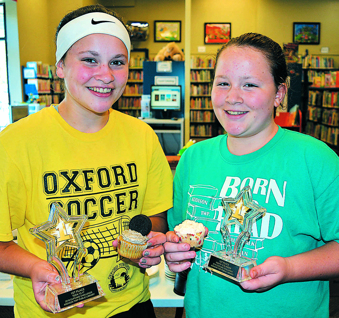 In the cupcake baking contest, Addison Township sisters Gracie (left) and Sarah Phelps won first place in the teen and youth categories, respectively. Photo by C.J. Carnacchio