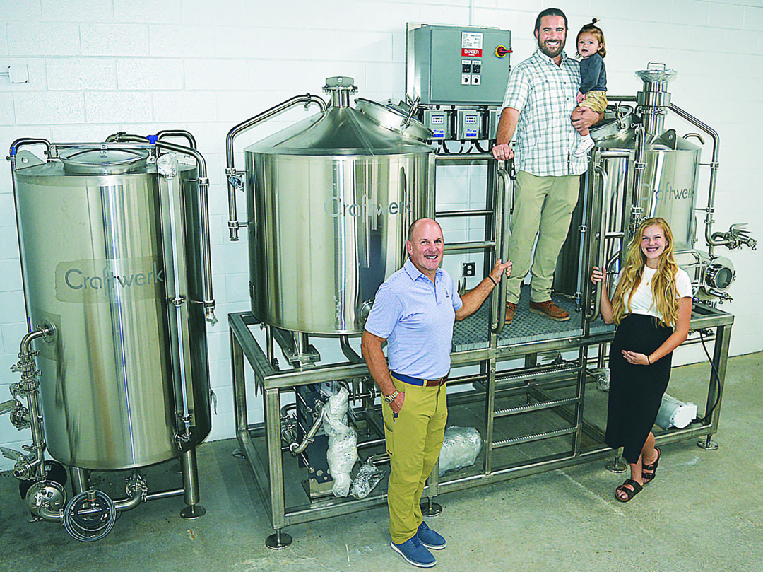 At the heart of the One Drop Brewing Co. are (from left) Ken Matheis, Ben Schnurle, 1½-year-old Theodore  and Morganne Matheis. Photo by C.J. Carnacchio. 