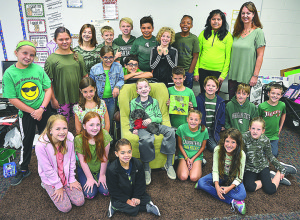 The fifth-graders in teacher Jodie Viviano’s class at Oxford Elementary School worked hard to raise awareness and money to help fight mitochondrial disease, which affects their classmate Gavin Lawrey (sitting in the chair). Photo by C.J. Carnacchio.