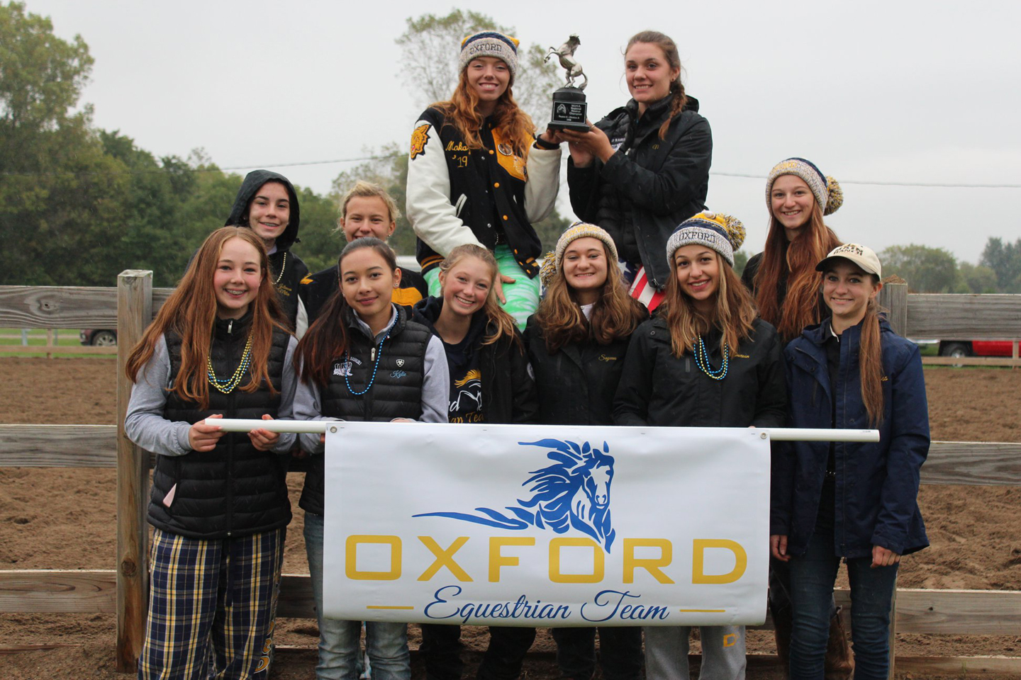 Oxford’s equestrian team poses with its trophy. Photo provided.