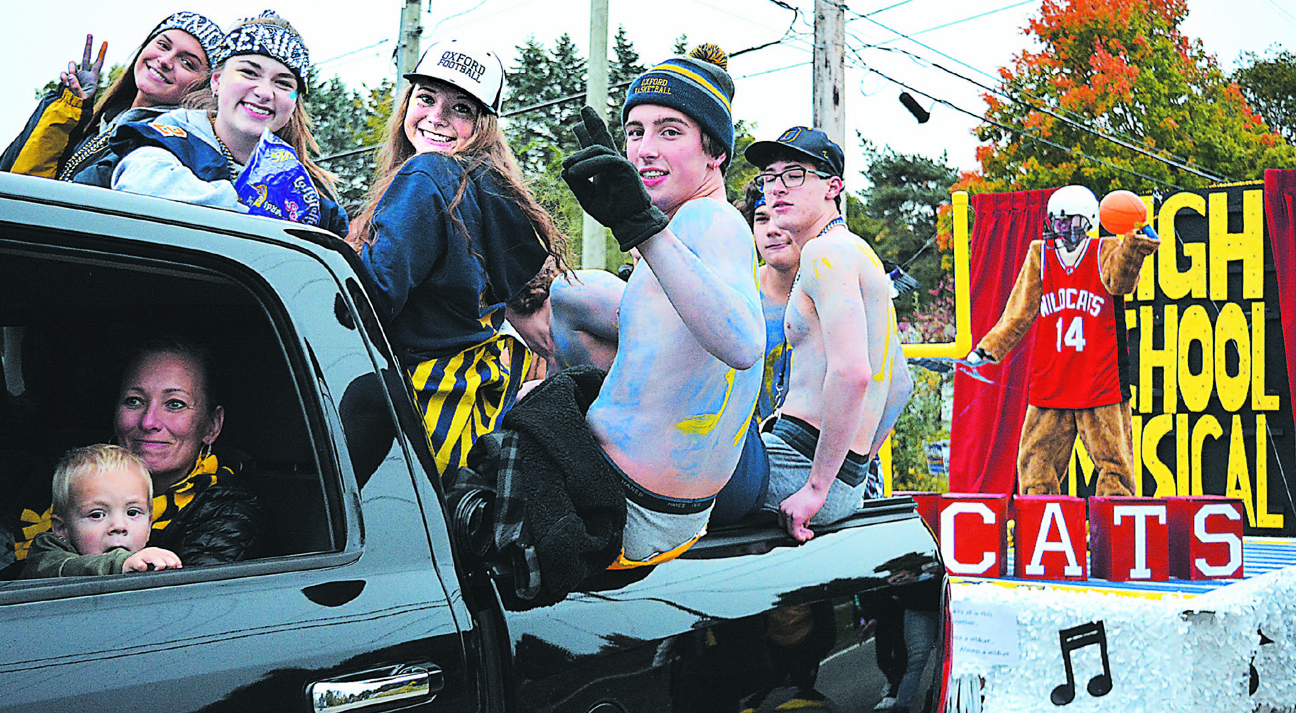 Members of Oxford High School’s senior class were all fired up for the big game as they towed their float, which won the competition. Photo by C.J. Carnacchio.