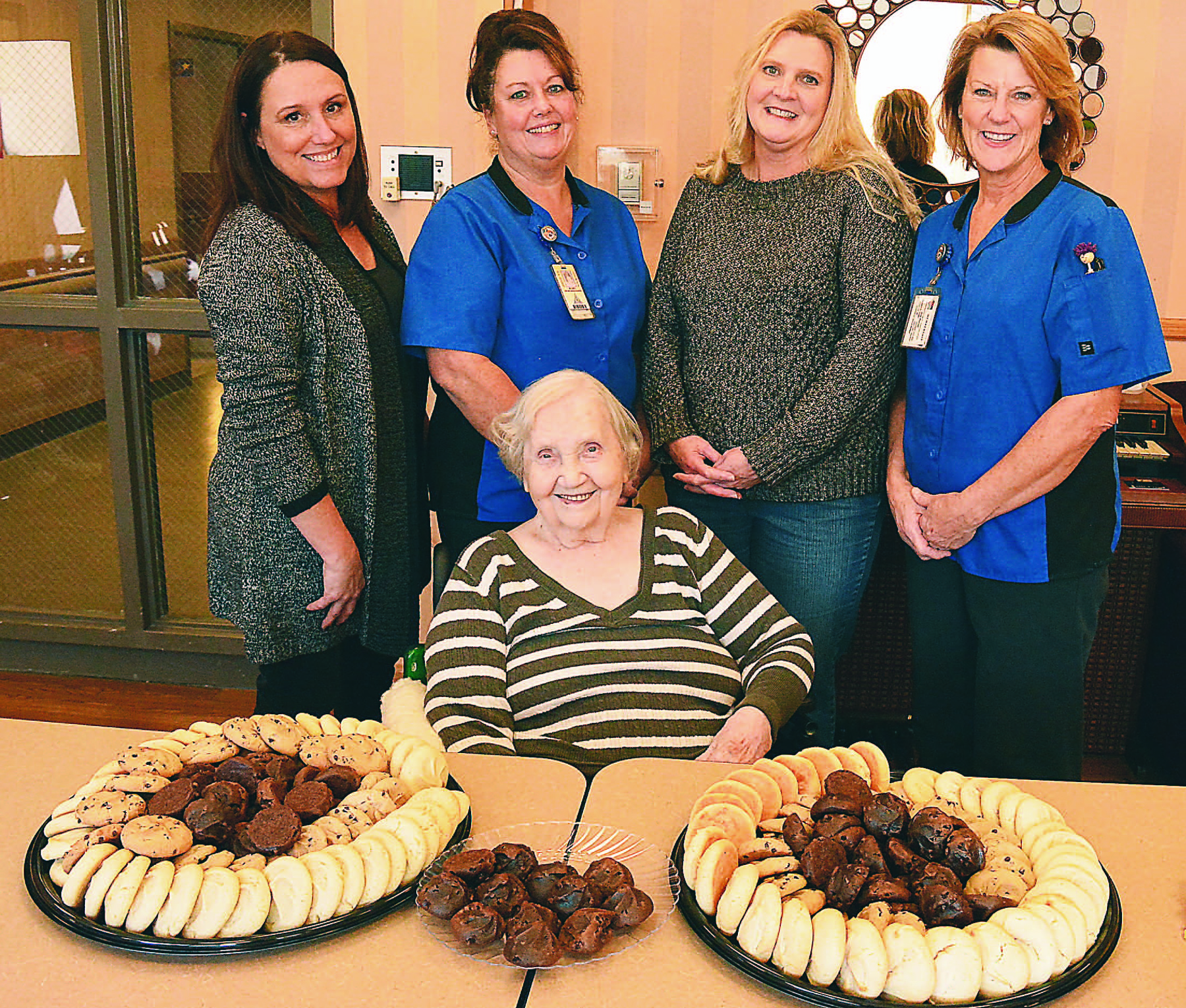 Longtime Leonard resident Mary Sue Sutherby (seated) celebrated her 100th birthday on Nov. 14 with 200 cookies brought to her by (from left) Ursula Tilley, Patty Silorey, Amy Bellamy and Jean Precour, all employees of Oxford Schools’ Food Service Department. Sutherby was the head cook for the Leonard and Lakeville schools until she retired in 1981. Happy birthday, Mrs. Sutherby! Photo by C.J. Carnacchio.