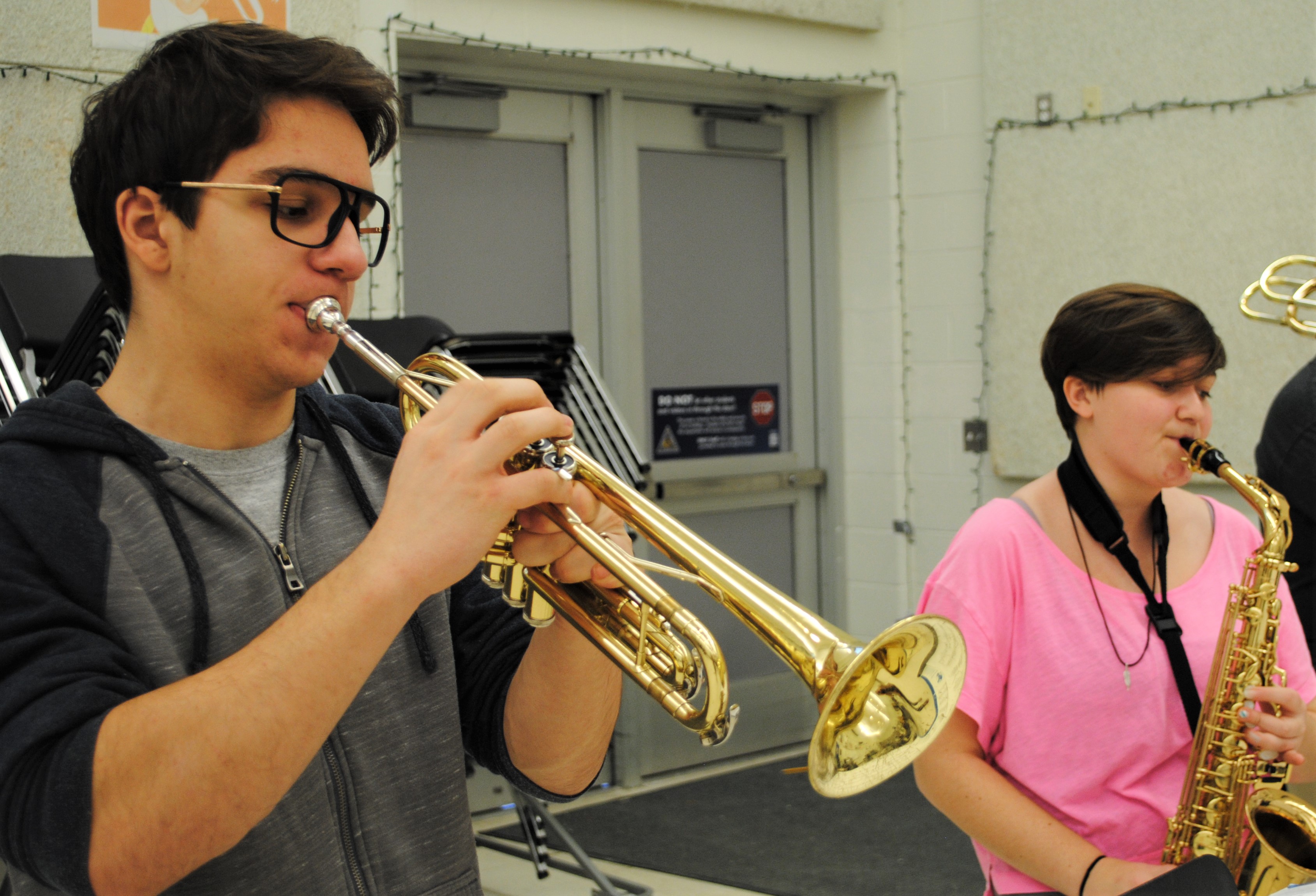 Oxford High School senior Gio Paese and junior Jane Tucker on the trumpet and saxophone in preparation for their big concert. Photo by Shelby Tankersley.