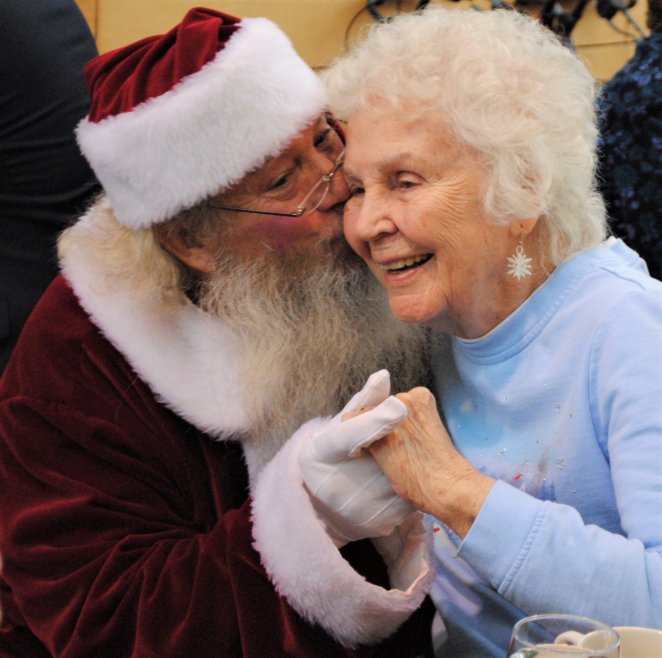 Millie Solon got a gift few received, a smooch from Santa. He told her to not tell Mrs. Claus. Photo by Shelby Tankersley. 