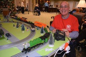 Orion Township resident Dennis Lakomy brought one of his model train sets to Independence Village of Waterstone in Oxford last week to share with senior residents and their visitors. Photo by C.J. Carnacchio.