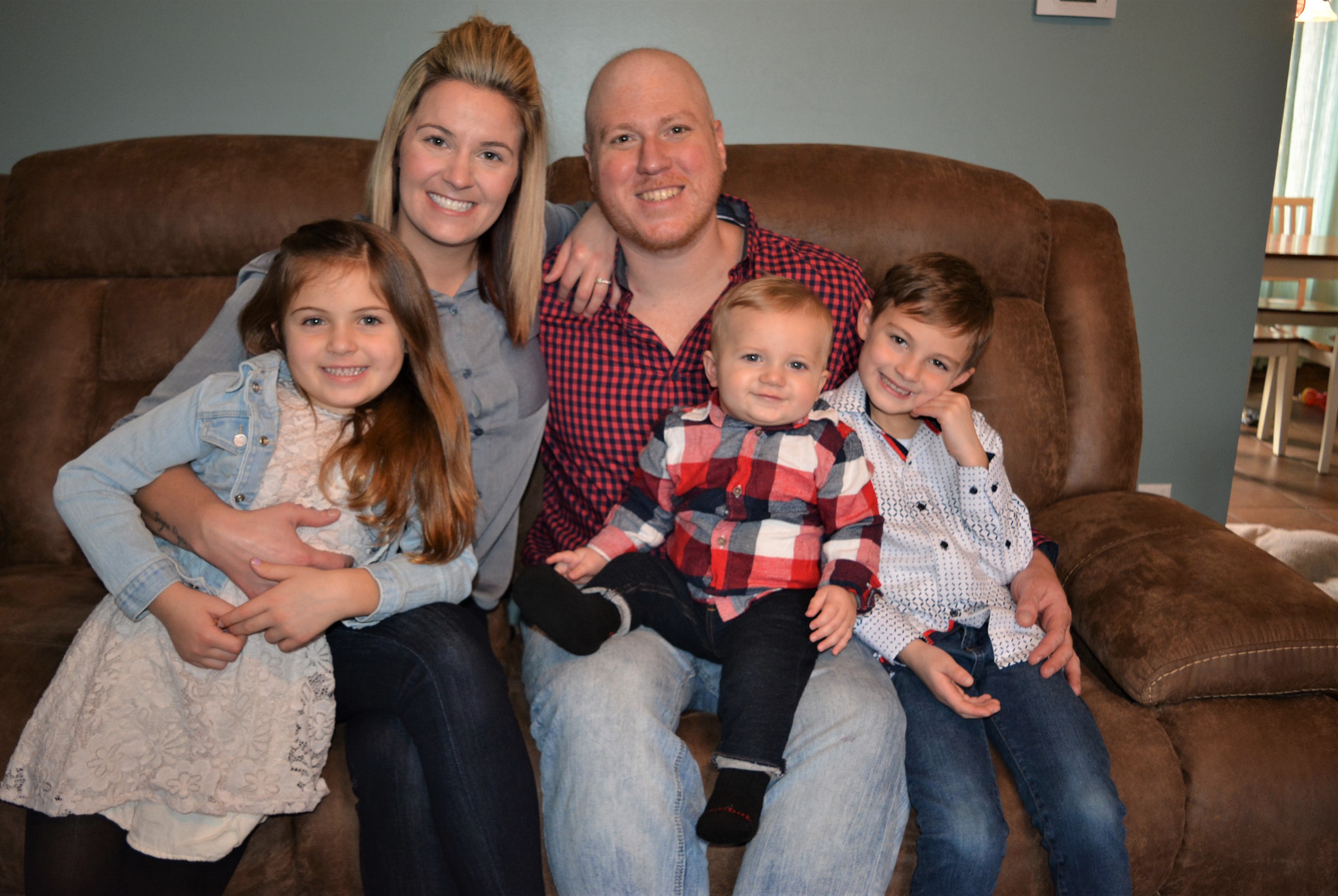 Oxford Village resident Eddie Kenny, his fiancee Breanna Bebernick and their children (from left) Ashtyn, E.J. and Jayce are facing cancer together. Photo by C.J. Carnacchio.