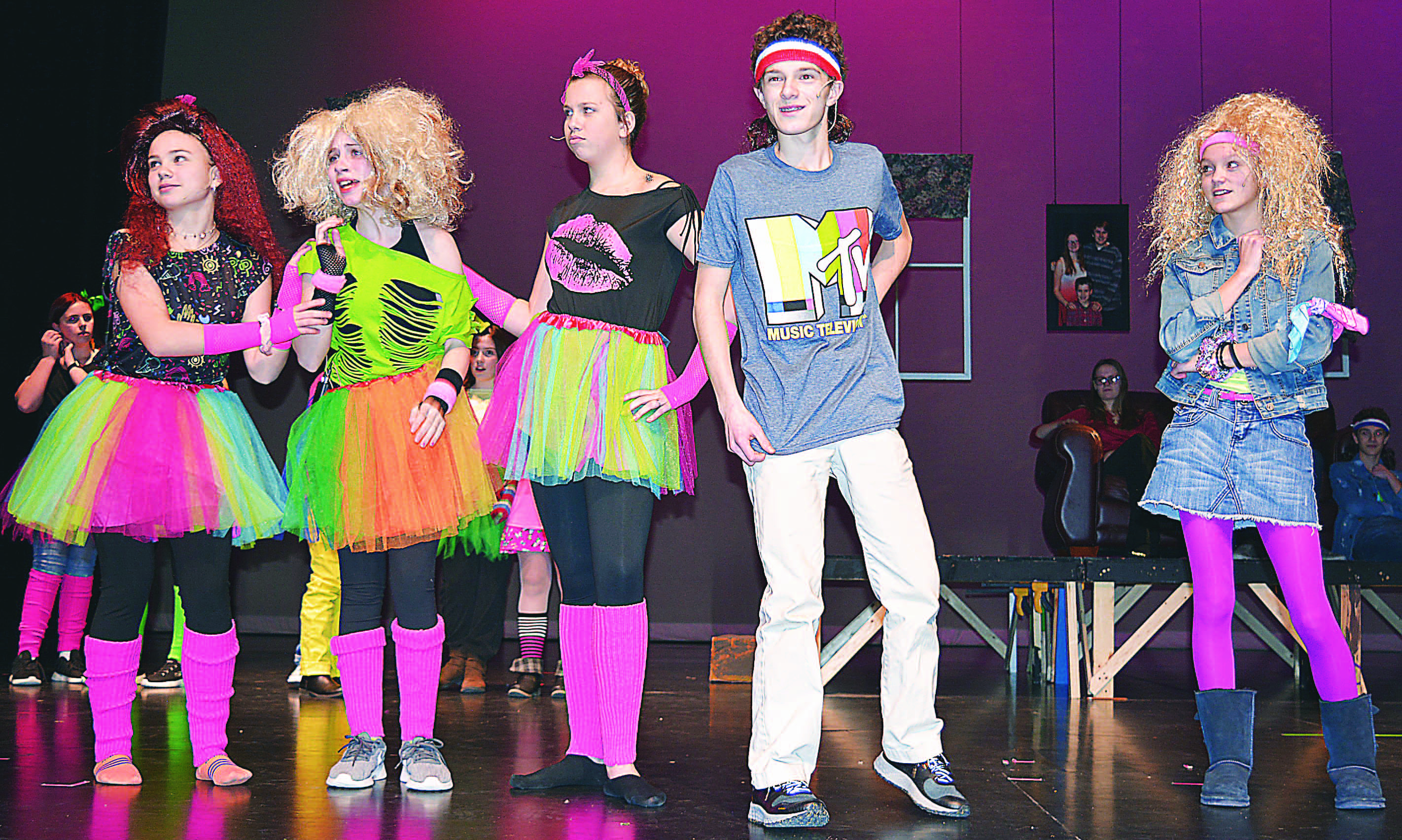 Dressed in 1980s fashions, Oxford Middle School Drama Club members (from left) Bella Delano, Lauren Schmidt, Layni Chaisson, Elijah Zelenock and Jessie Johnson rehearse a scene from the comedic play, “That’s Not How I Remember It.” It’s coming to the high school stage on Jan. 17 and Jan. 18. Photo by C.J. Carnacchio.