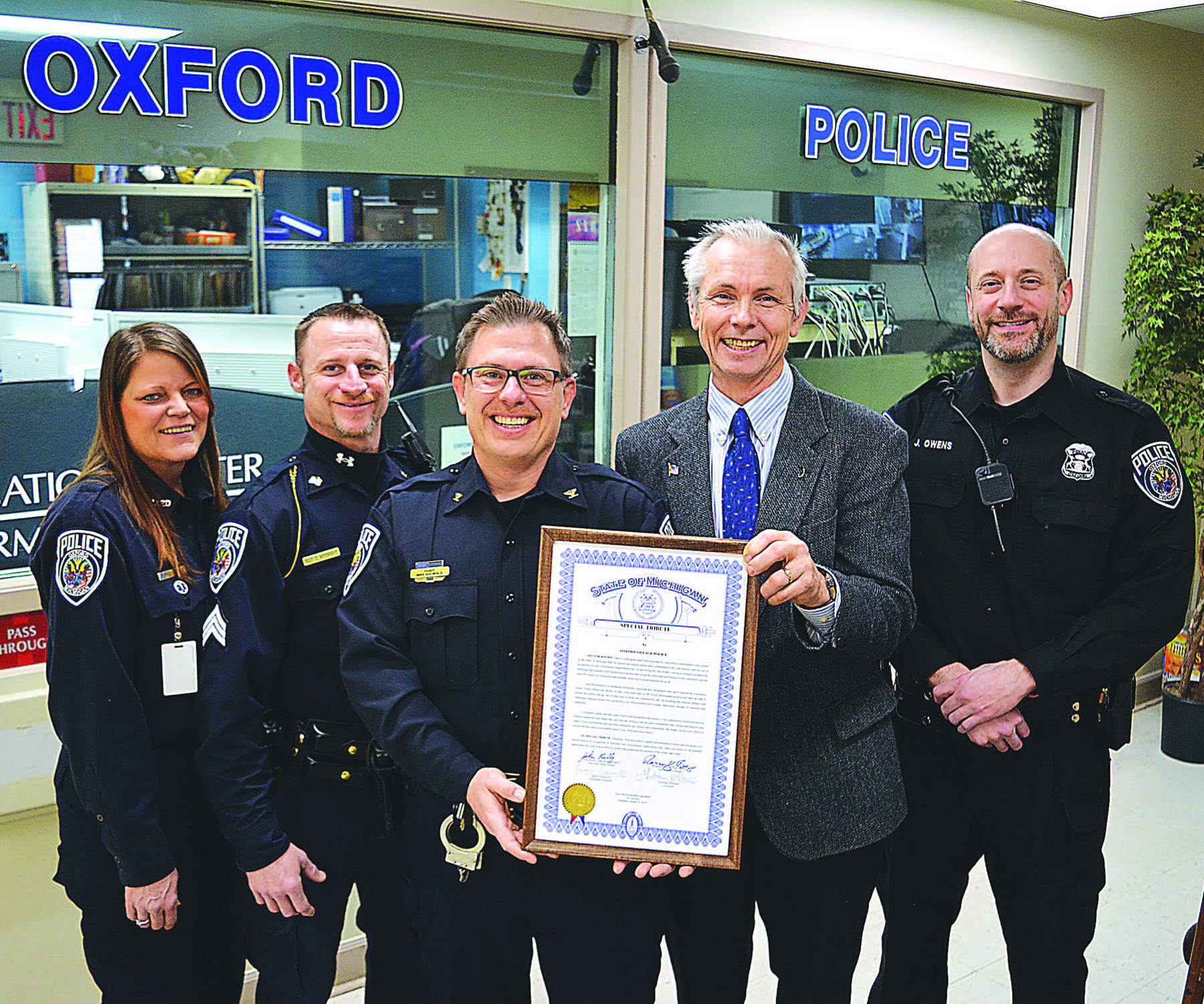 Oxford Village Police Chief Mike Solwold (center left) received a special tribute for National Law Enforcement Recognition Day from State Rep. John Reilly (center right). Flanking them are (from left) Service Officer Robyn Zanin, Sgt. Clint Ascroft and Officer James Owens. Photo by C.J. Carnacchio.