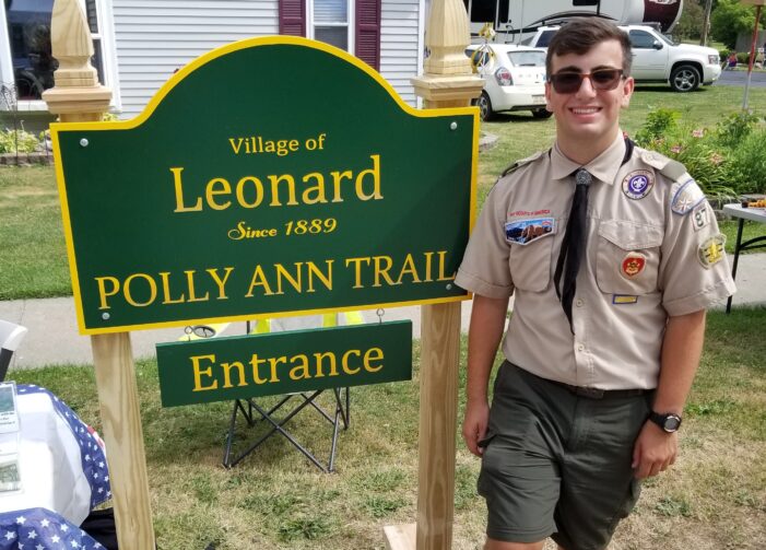 Leonard youth earning his Eagle Scout badge