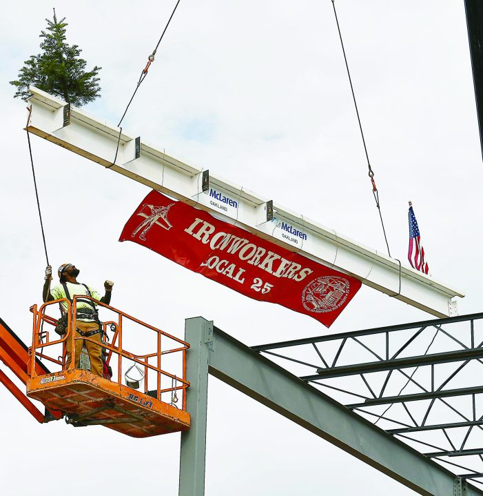 Final steel beam placed at McLaren Oakland construction site