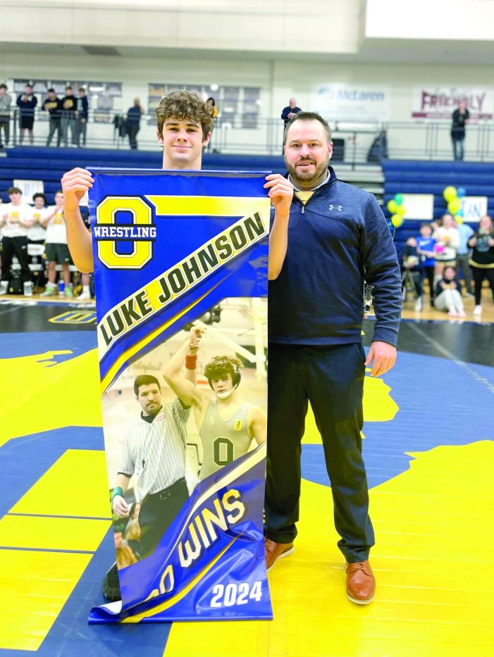 Oxford’s Johnson gets 100th victory